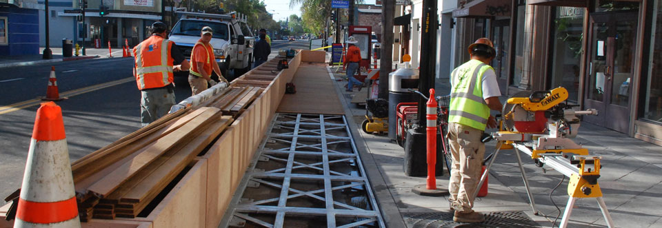 Men working on a sidewalk construction site